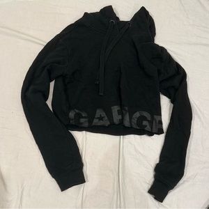 garage cropped black hoodie with word garage on bottom of the hoodie